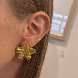 The Audrey Big gold flower stud earrings, dress up any outfit